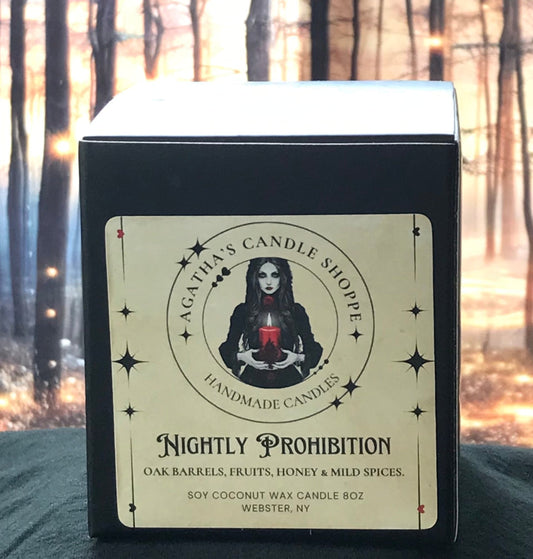 Candle box of 'Agatha's Candle Shoppe' label  as Nightly prohibition, scent of oak, fruit, honey and spice, with a gothic, withy theme against a forest background with mystical twinkle lights