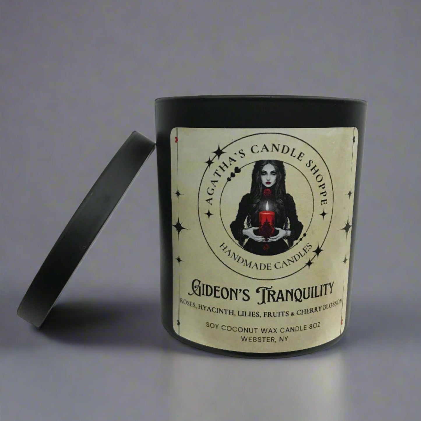 Candle of Gideon's tranquility Natural Soy Candle, with  lid off and a label with a gothic witchy theme