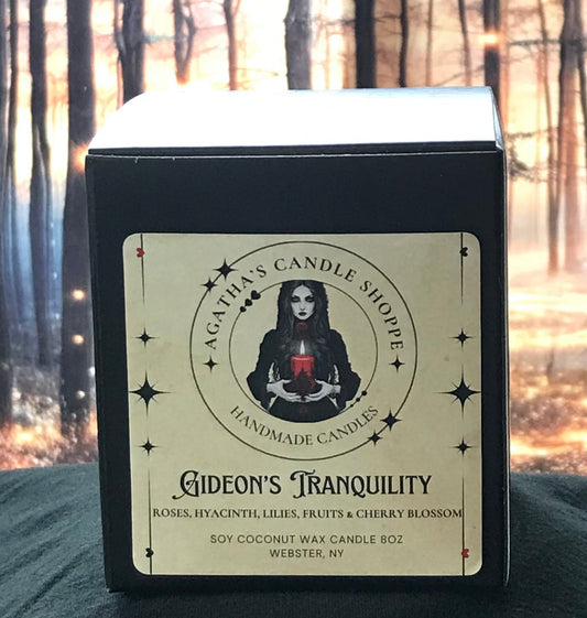 Gideon's Tranquility Soy Candle with a black box and gothic theme , background of a forrest with mystical magical twinkles of light