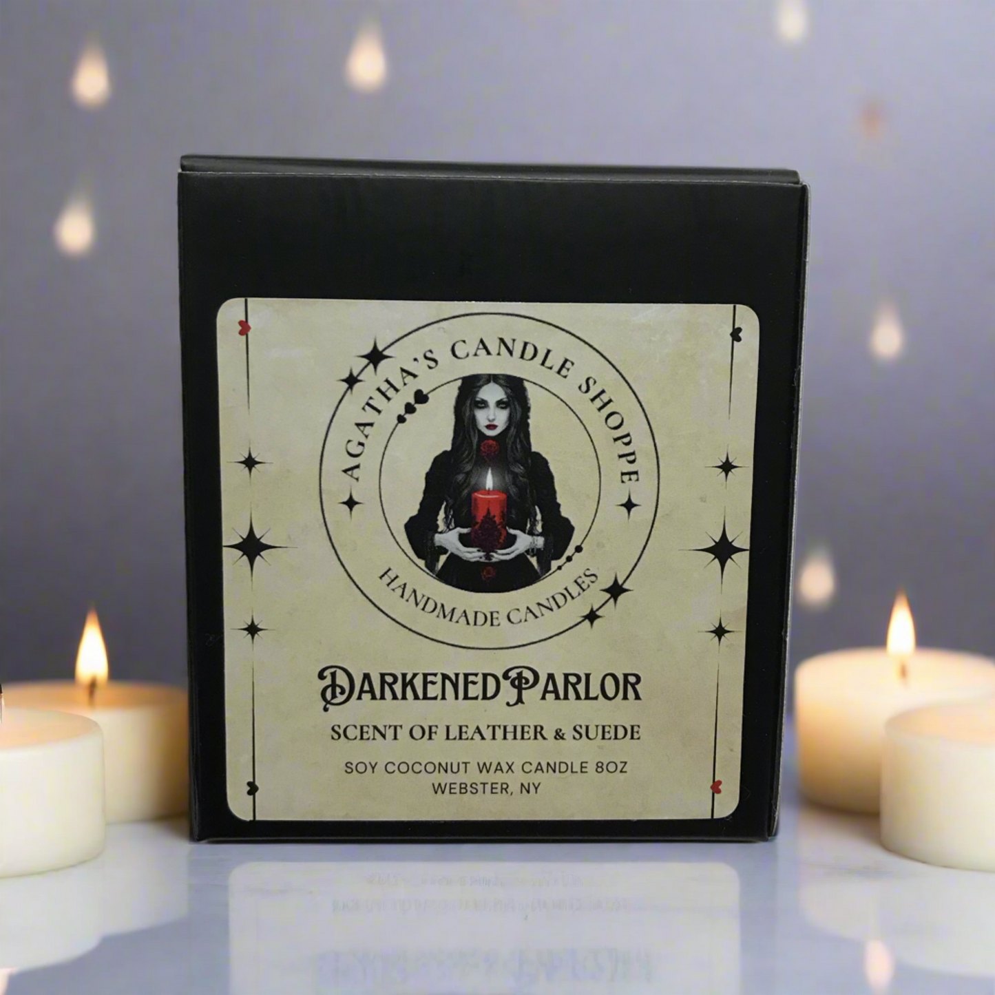Darkened Parlor Natural Soy Candle in box, with tea light candles lit near the box.